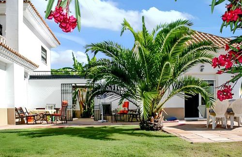 Nuevo Portil Villa | Elegant Villa in Nuevo Portil with Shared Pool