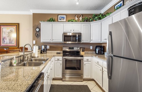 West Panama City Beach Condo | Emerald Isle 2206 - Front row beach chairs included! Assigned parking!