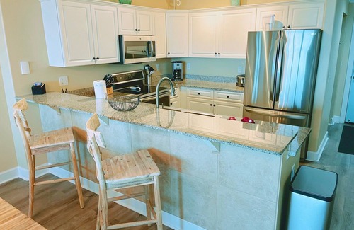 West Panama City Beach Condo | Emerald Isle 904 - Front row beach chair service included! Affordable rates!