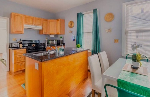 Tremont House | Emerald Oasis: Cozy Tremont 1BR Lower Unit by Christmas Story House | Parking 7 Min to Downtown