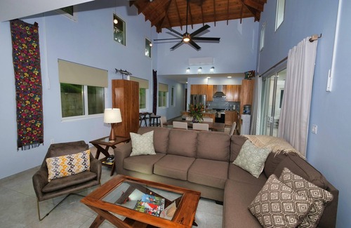 Antoneys Cay Villa | Enchanting blend of sea views and lush green hillside panoramas.