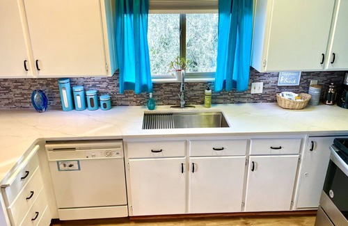 Seaside House | Enchanting Riverfront Getaway w/Hot Tub/Fire Pit/Covered Deck, Steps to Beach!