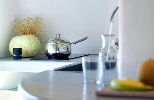 Apollonia Villa | Endearing Milos Suite | Cycladic Light Suite | Private Furnished Balcony | Outdoor Dining Area |.