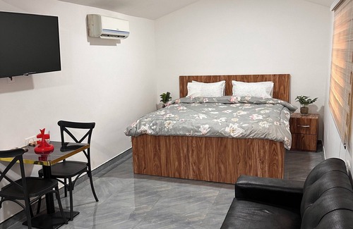 Accra Cabin | Enjoy a comfortable room with all the essentials for a great stay.