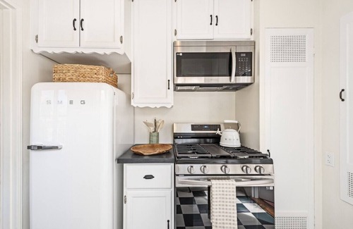 West Beach Apartment | Enjoy indoor-outdoor living, a full kitchen, and vintage coastal charm.