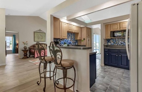 Deep Creek House | Enjoy lake views from the lanai. Charming 3-bdr home in quiet Deep Creek sub.