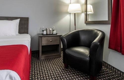 Grande Prairie Hotel | Enjoy Modern Comfort in Clean Room, Steps from Majors Restaurant