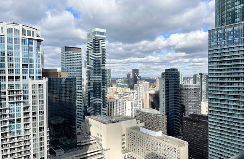 Bay Street Corridor Apartment | Enjoy panoramic city views from this stylish apartment near Dundas Square