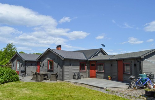 Dalaro House | Enjoy relaxing baths in the jacuzzi with sea view in this vacation home.