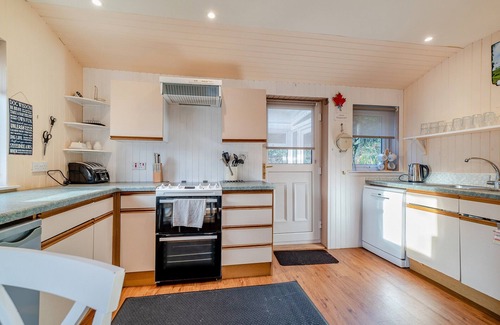 Corrie Cottage | Enjoy stunning sea views from this traditional cottage on the coast of Arran.