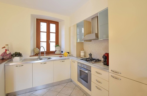Sovere Apartment | Enjoy the beautiful view of the countryside and this comfortable vacation apartment.