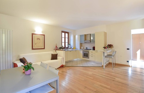 Sovere Apartment | Enjoy the beautiful view of the countryside and this comfortable vacation apartment.