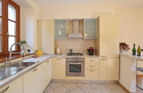 Sovere Apartment | Enjoy the beautiful view of the countryside and this comfortable vacation apartment.