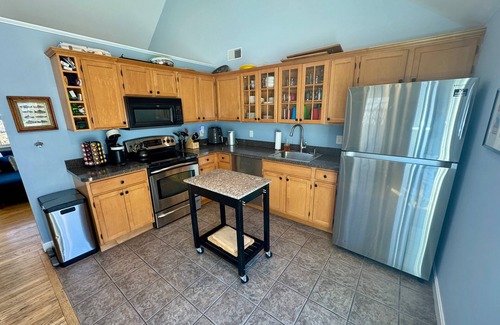 Brewster House | Enjoy the charm of this Cape Cod getaway; coastal elegance meets modern comfort and tranquility.