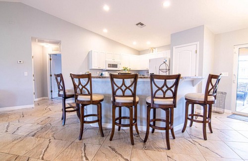 Diplomat House | Enjoy the Salt Life with this Heated Saltwater Pool and outdoor lanai.