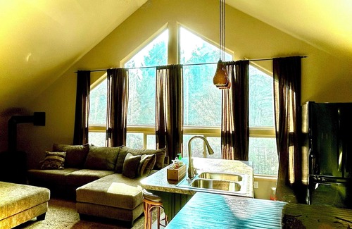 Island Park House | Enjoy the spacious vaulted ceilings with a full kitchen and open concept living!