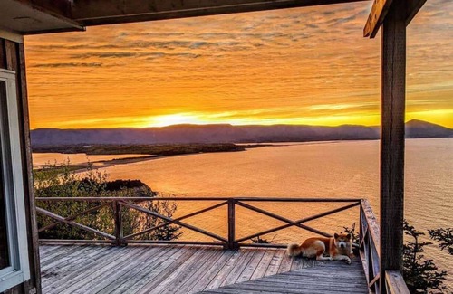 White Point Cottage | Enjoy the stunning views of the Cape Breton Highlands atop this cliffside estate
