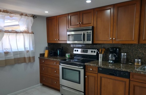Bahamia West Condo | Enjoy the view from this penthouse condo on the turquoise coloured bay