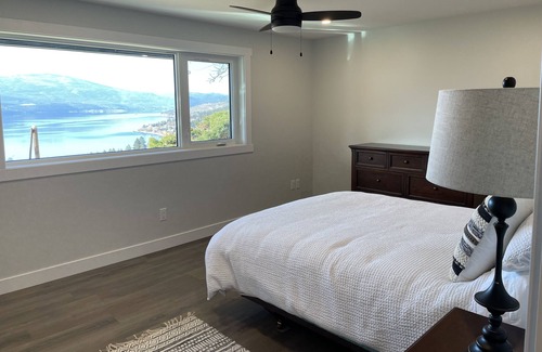 Central Okanagan House | Enjoy the view of Okanagan Lake while relaxing on this private two acres of land