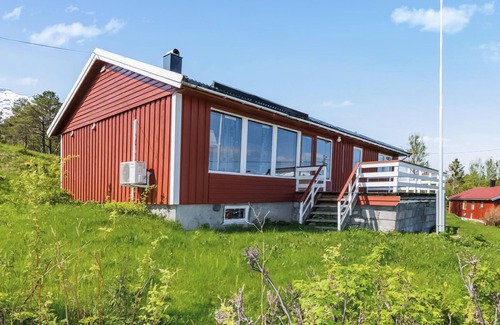 Steigen House | Enjoy the view of mountains and forests in this cozy vacation home.