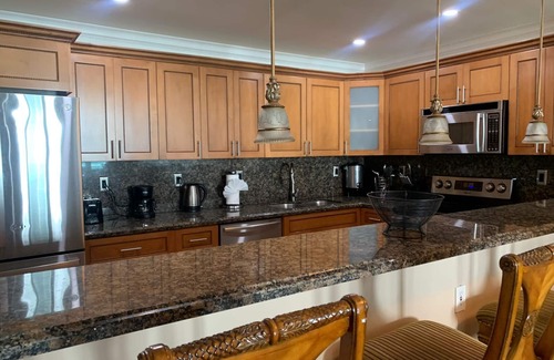 Aventura Condo | Entire condominium with a pool view, steps from the beach