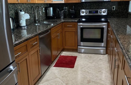 Aventura Condo | Entire condominium with a pool view, steps from the beach