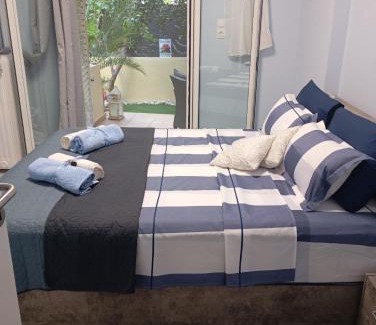 Irakleio Apartment | Ηome & Garden with parking close to Olympic Stadium