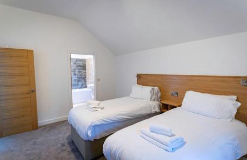 Farley House | Errwood, woodland lodge with hot tubs for 14