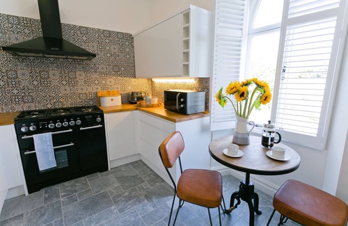 Menai Bridge Apartment | Eryl Mor - a coastal that sleeps 14 guests in 7 bedrooms