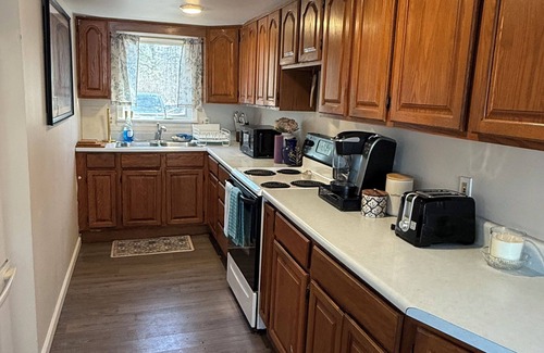 Lupton Cottage | Escape to a cozy cottage on Ausable Lake, in Lupton, Michigan!