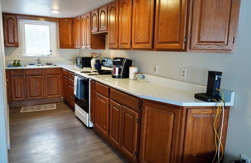 Lupton Cottage | Escape to a cozy cottage on Ausable Lake, in Lupton, Michigan!