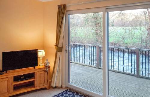 Hopton Castle Cottage | Escape to a modern riverside lodge, perfectly set by the tranquil River Clun.