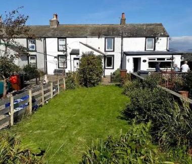 Calder Bridge House | Escape to our Cosy Cottage with Log Burner in Drigg, Lake District