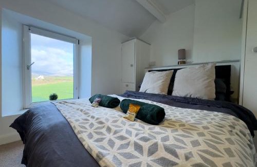 Calder Bridge House | Escape to our Cosy Cottage with Log Burner in Drigg, Lake District