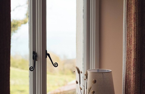 New Quay House | Escape to Panteg, a charming coastal retreat that blends traditional character with modern comfort,