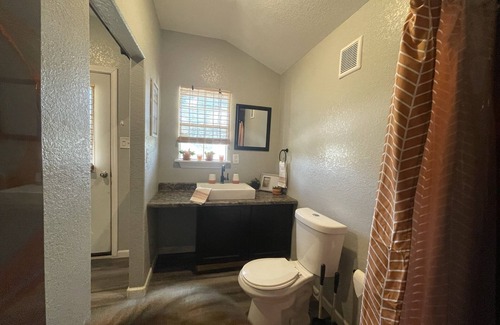 Brazoria Cabin | Escape to Serenity: Discover the Rustic Charm of the Wade Cabin at Tripl RV Park