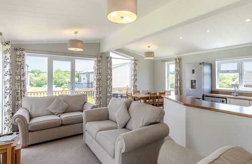 Hewas Water Ski Chalet | Escape to the Jasmine Lodge, nestled amidst stunning rolling countryside.