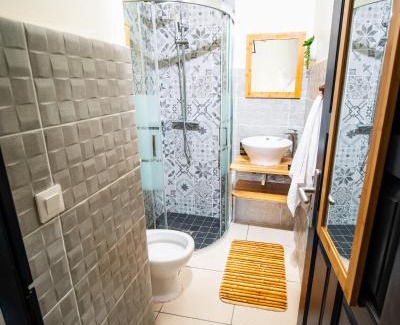 Port-Louis Apartment | Evasion en plein cœur de la ville Studio Jacuzzis Sauna et piscine au centre de Port-Louis