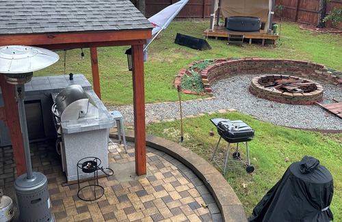 Olivia House | Executive style home in Lillington, NC with outdoor kitchen and fire pit