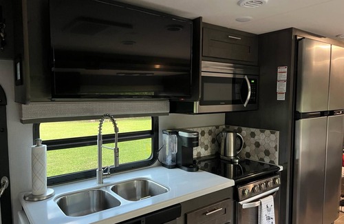Parkland House | "Experience Enchantment: Book Your Dream Stay at The Magic Motor Home Today!"
