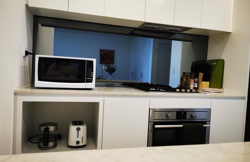Ryde Apartment | Experience serenity in this modern havennTrain/Ferry to City~Shops~Parking