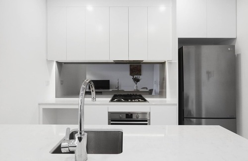 Ryde Apartment | Experience serenity in this modern havennTrain/Ferry to City~Shops~Parking