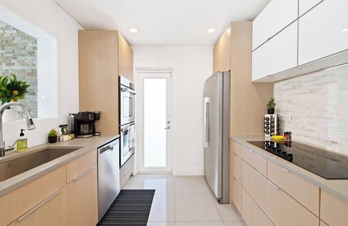 Poinsettia Heights House | Experience the Canary House, a Modern Spacious 3 Bed Private Heated Pool Retreat.