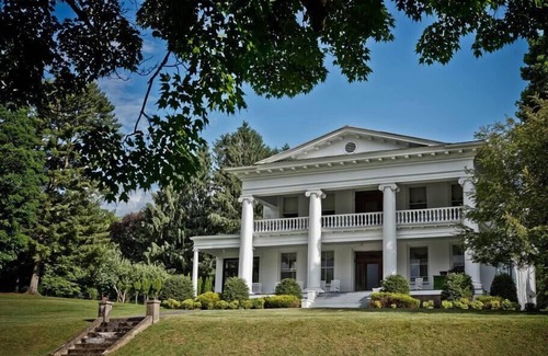 Tazewell House | Experience the vibrant Nelle May Room at the historic Litz Mansion in Tazewell, VA