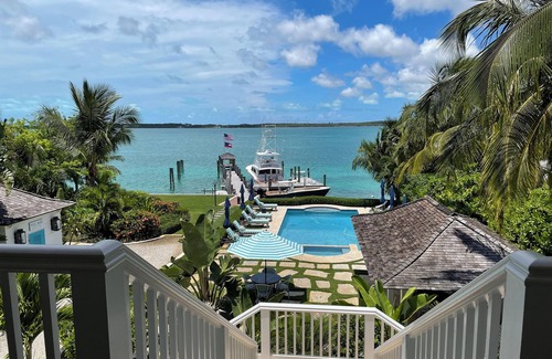 Dunmore Town House | Exquisite Bay front Estate, dockage 100' boat, LG pool, close to town and beach.