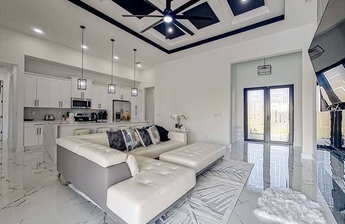 Diplomat House | Exquisite riverfront home with pool, lanai, fireplace, W/D, 7 dog-friendly