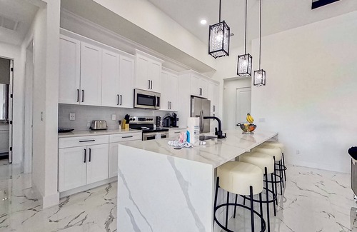 Diplomat House | Exquisite riverfront home with pool, lanai, fireplace, W/D, 7 dog-friendly