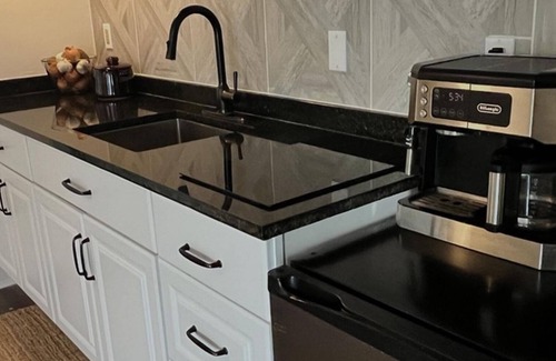 Central City Cottage | Extended Stay near Downtown, Hospitals and Coworking Spaces.