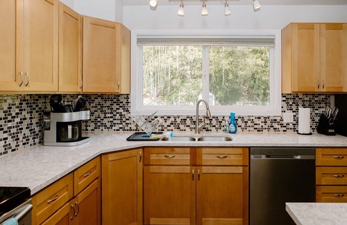 Port Angeles East House | Eye-catching Home and Yard w/Luxurious Hot Tub, Patio, and Private Trail Access