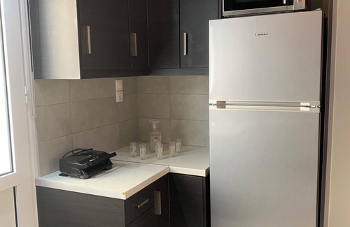 Spata-Artemida Apartment | F.K.Apartments is situated 50m away from the beach and 10km from the ATH.Airport